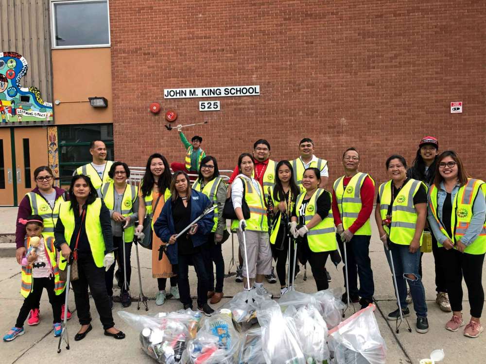 Photo Supplied
Members of Barangay West End in front of John M. King School. The group holds community events throughout the year, including a barbecue and family fun day. The group is planning more events, and hopes to bring more West End residents together.