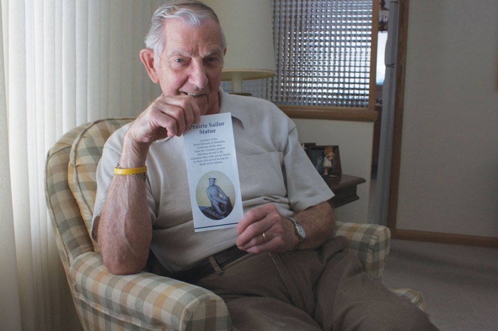 Photo by Dan Falloon
Robert Watkins shows off the brochure he’s distributing to fundraise for a statue to honour sailors from the prairie provinces.