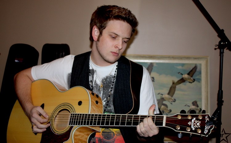 Singer/songwriter living the dream – Our Communities