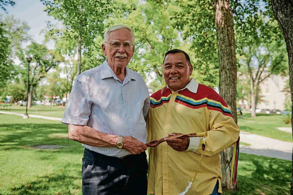 Photo courtesy of the Winnipeg Foundation
(From left) Circles For Reconciliation project coordinator Raymond Currie and Indigenous ambassador Clayton Sandy are shown with a talking stick that is used in a circle.