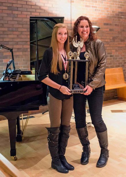 Submitted photo
(Left) Kiahna Chumola received the Meridian Festival’s Most Outstanding 
Performance trophy from festival committee member Cathy Arnal.