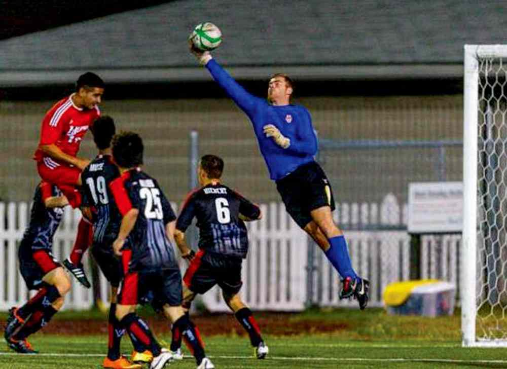 Supplied photo
Tyson Farago (in blue) has been named the Manitoba Soccer Association’s 2013 outstanding senior male player. He now plays goalkeeper for FC Edmonton.