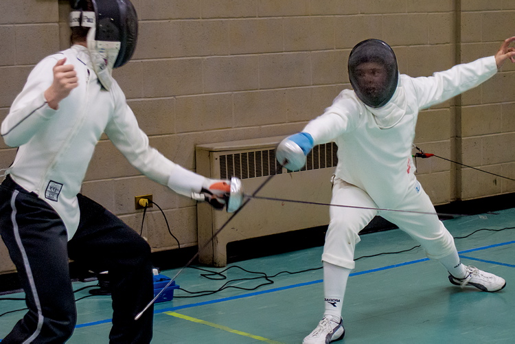 photo by Gail Perry
Two members of the Lightning Fencing Club cross épées. You can try this out too, by visiting their Wolseley-based fencing salle.