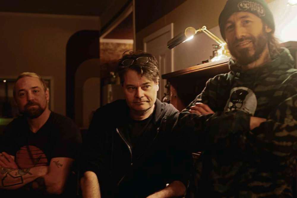 Photo by Cody Sellar
Owner Cam Loeppky (centre) sits with friends Rusty Matyas (left) and Chrys Fournier (right) at Argyle Studio.