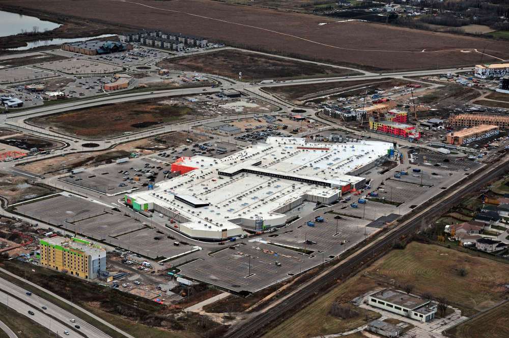 Supplied photo
An aerial look at the Seasons development facing southwest. The Hilton Garden Inn is pictured at the far left and Outlet Collection Winnipeg is pictured at the centre. The building has a white membrane roof to reduce heat absorption. To the right, three residential developments are under construction, including a facility specializing in memory care for people with Alzheimer’s, a 10-storey 55-plus life lease building, and 416 suite luxury apartment block. To the south, about 50 acres of land remains to be developed over the next five years.