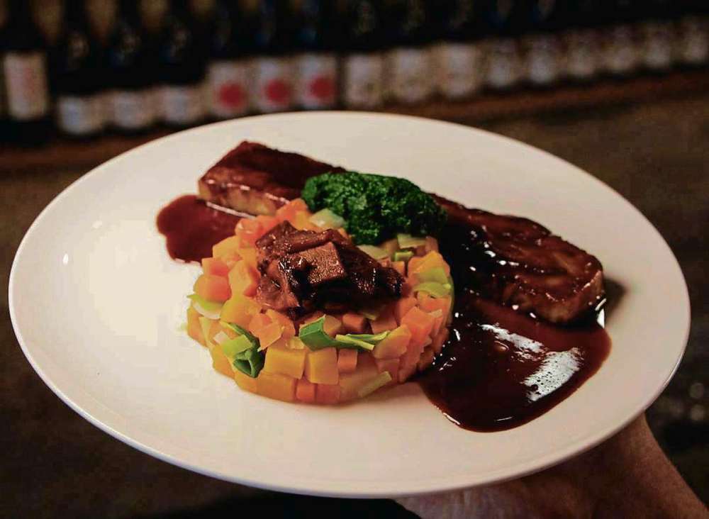 Supplied photo
The Oxbow’s smoked beef brisket, tongue, root hash, arugula, demi-glace, prepared by chef Sean Bernard.