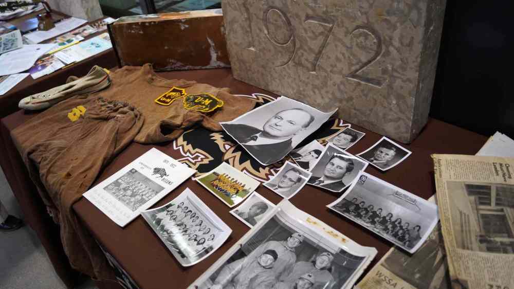 Danielle Da Silva
The contents of the time capsule sealed with the building of the Frank Kennedy Centre in 1972 were put on display at the opening of the Active Living Centre. Items included an old Converse shoe, a U of M jersey and newspapers from the day the capsule was sealed. A time capsule containing items from the April 7 opening of the Active Living Centre will be sealed behind a date stone. The time capsule from 1972 will also be sealed again when the date stone is reinstalled.