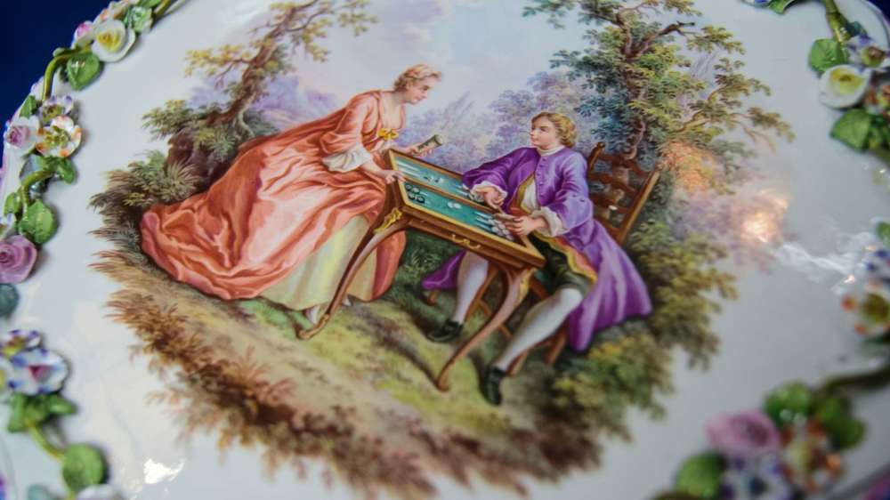 Danielle Da Silva - Sou'wester
This hand painted decorative table, about three times as large as a smart phone, is a masterpiece by Cooper’s standards. It was crafted by Meissen porcelain in Germany, circa 1850.