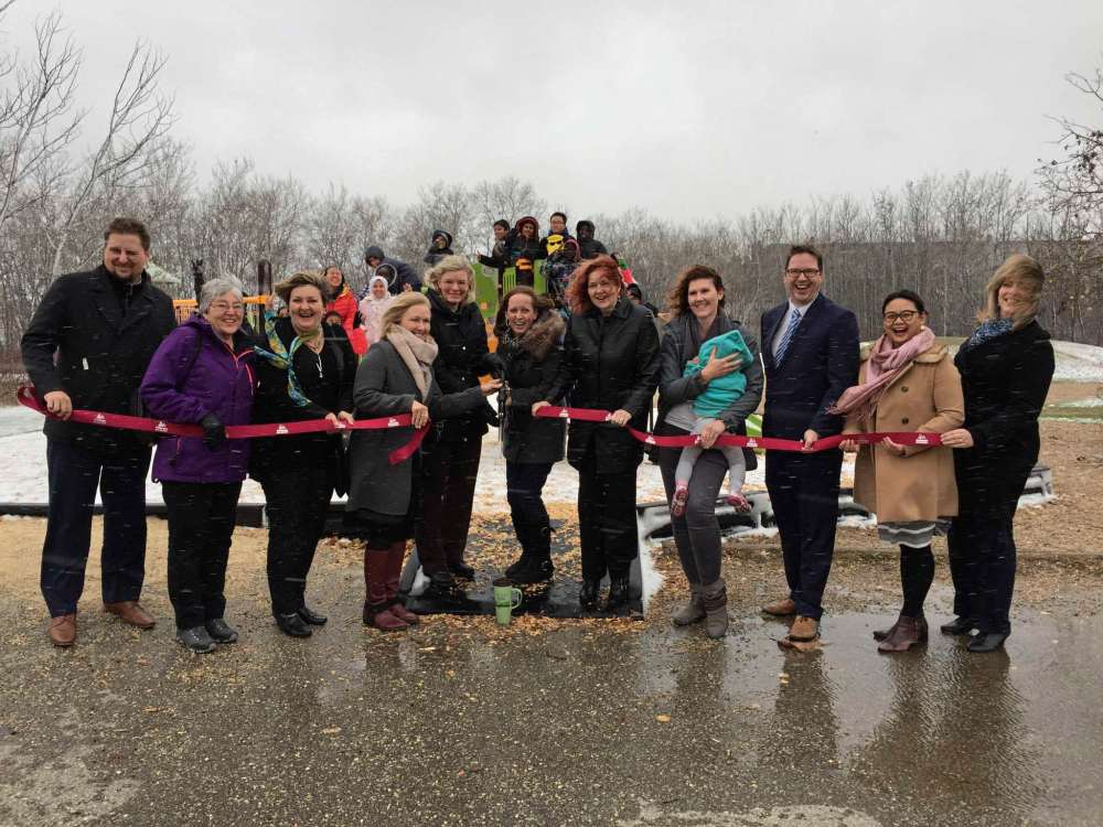 Supplied photo
Parents and children in Fort Richmond recently celebrated the completion of a years-long Dalhousie School playground rehabilitation project. Pictured from left: Michael Lacroix, Carol Coburn, Janice Lukes, Marina Wilson, Suzanne Pothe, Jaime Webster, Jennifer Bracken, Julie Fisher, Lee Fehler, Miriam Delos Santos, and Cindy Warren.