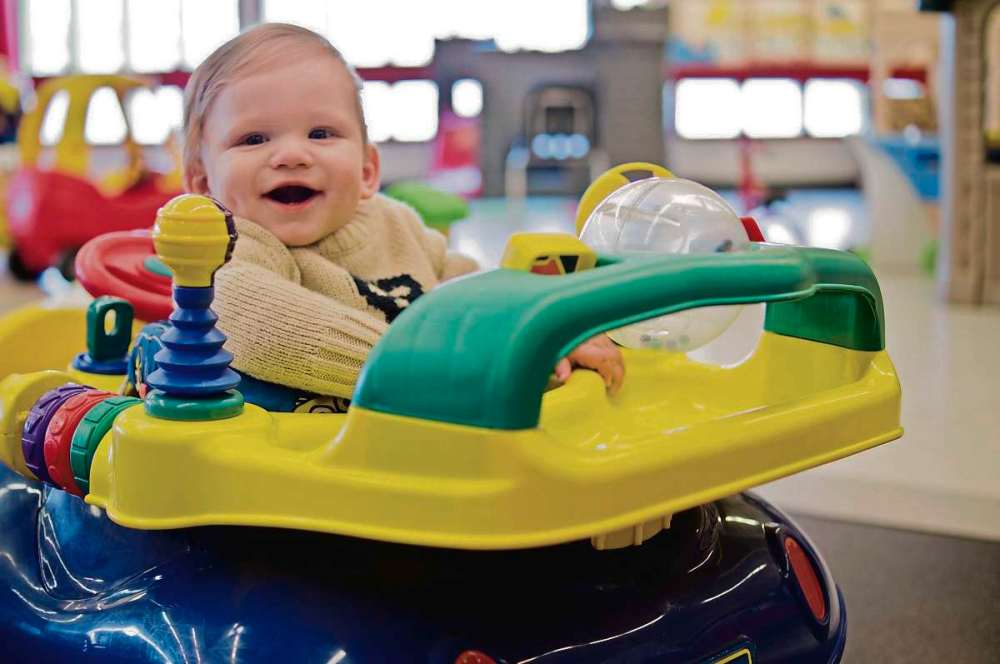 Photo by Danielle Da Silva
Nine month old Kayson dropped in on Earl Grey Community Centre’s Ride and Play program with his mom on April 17. The centre’s multipurpose room is filled with kids toys, play structures, and even a bouncy castle during the program.