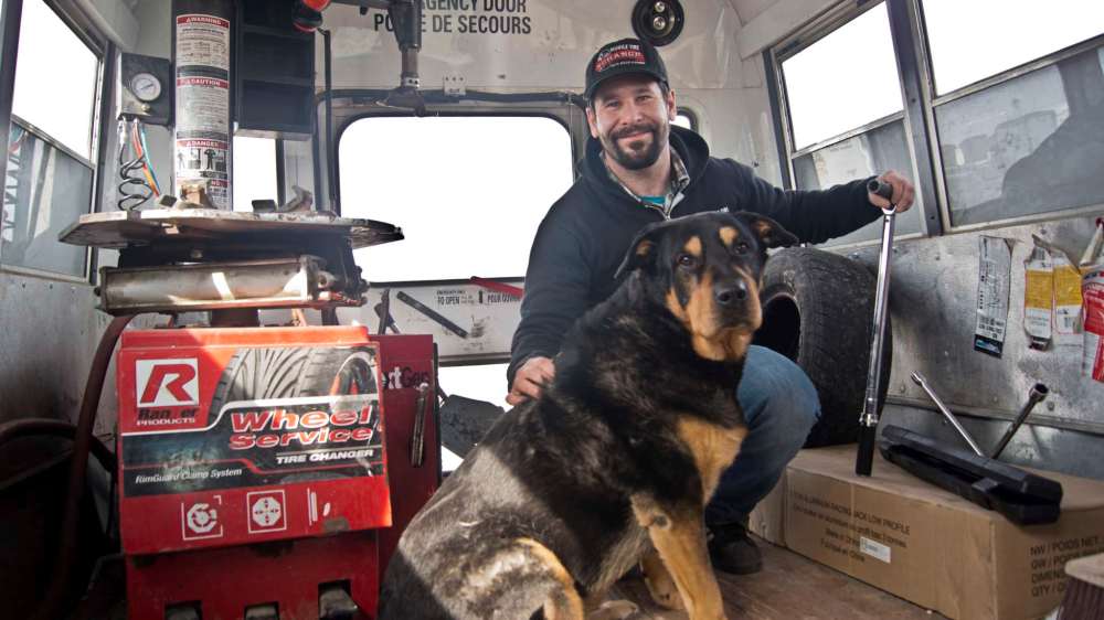 Danielle Da Silva - Sou'wester
Ethan Matras and his pup Lola are pictured in his mobile tire service truck. The 35-year-old has been operating Mobile Tire Xchange since 2013, bringing a garage to his clients.