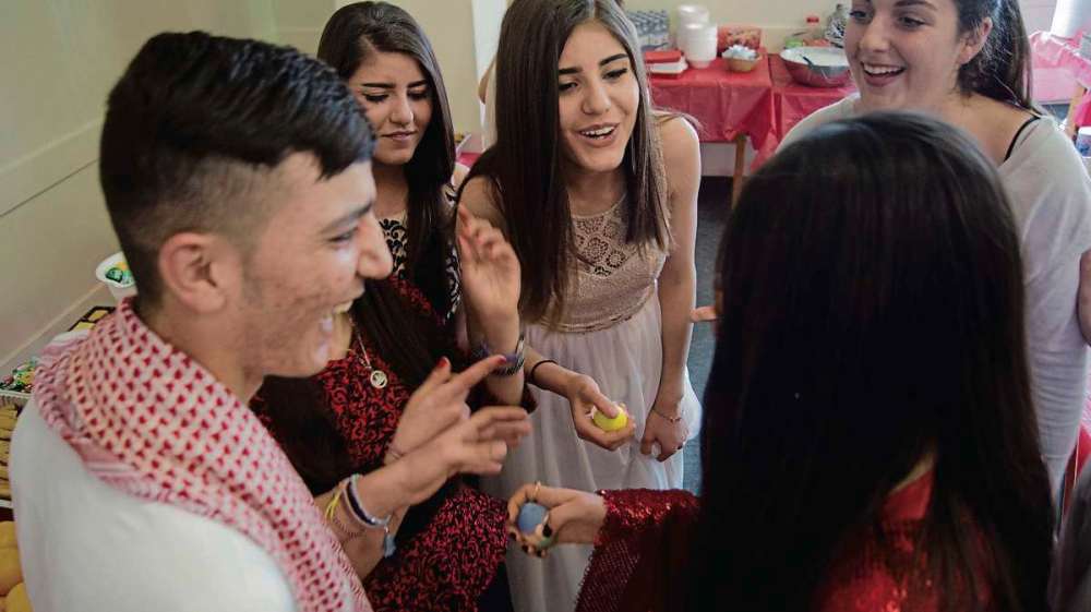 Danielle Da Silva - Sou'wester
April 19, 2017 - Members of Winnipeg’s Yazidi community celebrate the religious new year at the First Unitarian Universalist Church with a game featuring coloured, hard boiled eggs that are struck against one another. (DANIELLE DA SIVLA/SOU'WESTER/CANSTAR).