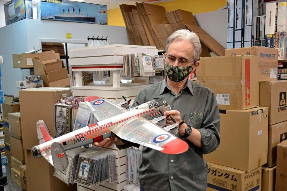 Photo by John Kendle
Laurie Taite examines a scale model of an RCAF rescue aircraft.