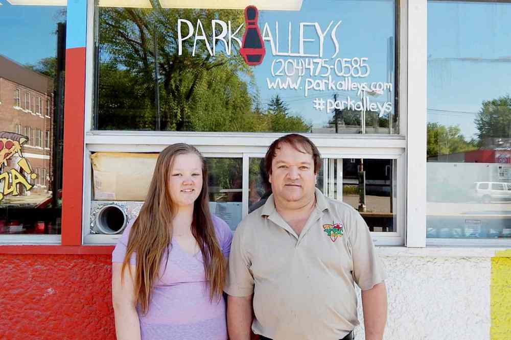 Photo by Adam Petrash
Park Alleys owner Mike Devenney, right, stands with his daughter Jennifer outside the newly-renovated Park Alleys bowling centre at 730 Osborne St.
