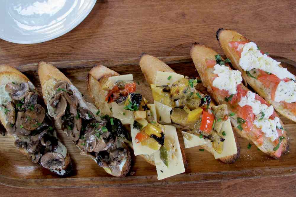 Photo by Kathryne Grisim
The bruschetta platter at Cibo Waterfront Café offers seven different choices, and diners can select three for their platter.