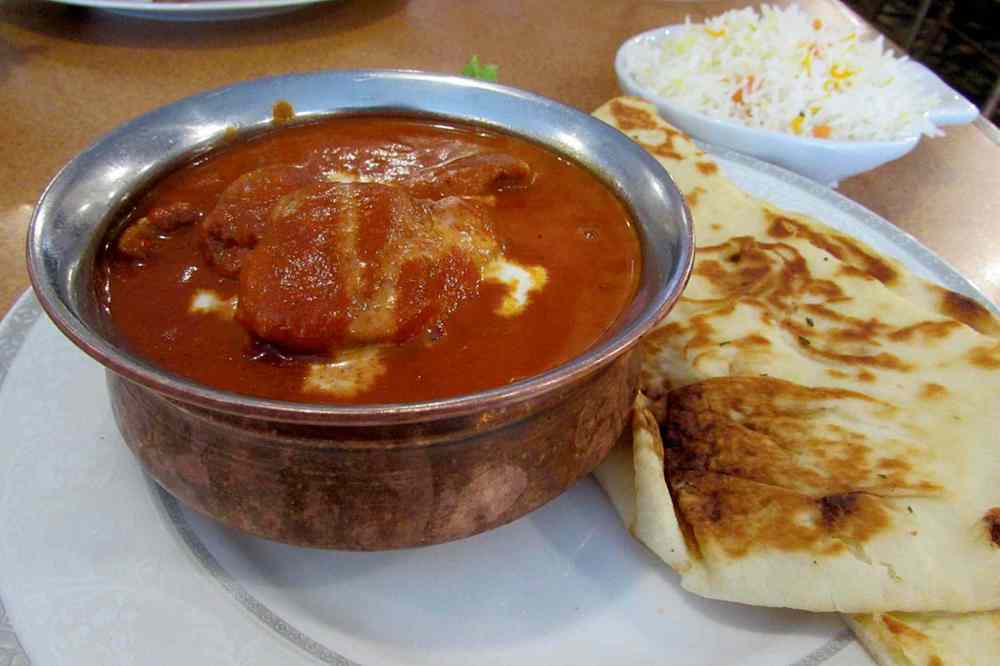 Photo by Kathryne Grisim
The Roadhouse’s butter chicken includes hearty pieces of both light and dark meat, and is served with pilau rice and buttery naan bread.