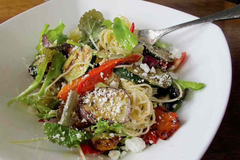 Photo by Kathryne Grisim
Mise is one of the many restaurants participating in Dine About Winnipeg. Pictured: the restaurant’s angel hair pasta with grilled vegetables, concasse tomatoes, Kalamata olives, feta cheese, pickled eggplant, wilted greens and artichoke hearts, (which may not necessarily be among the dishes offered).