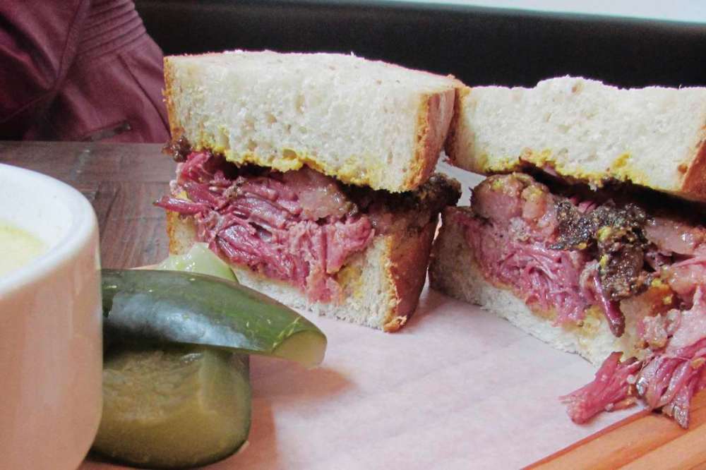 Photo by Kathryne Grisim
The River City Brisket sandwich at King + Bannatyne strikes a beautiful balance of meat and fat and benefits from a spicy rub and house-made mustard.