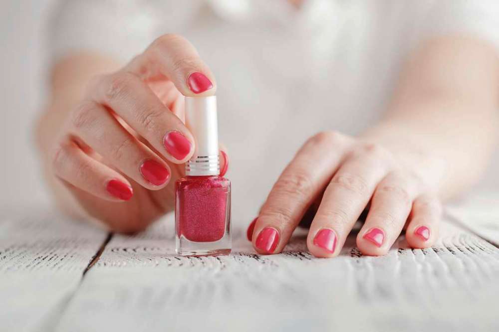 Dreamstime.com
If the lid on your bottle of nail polish is stuck, wrap a rubber band around the bottle, then submerse in hot water for five minutes. Twist the bottle cap until it opens.