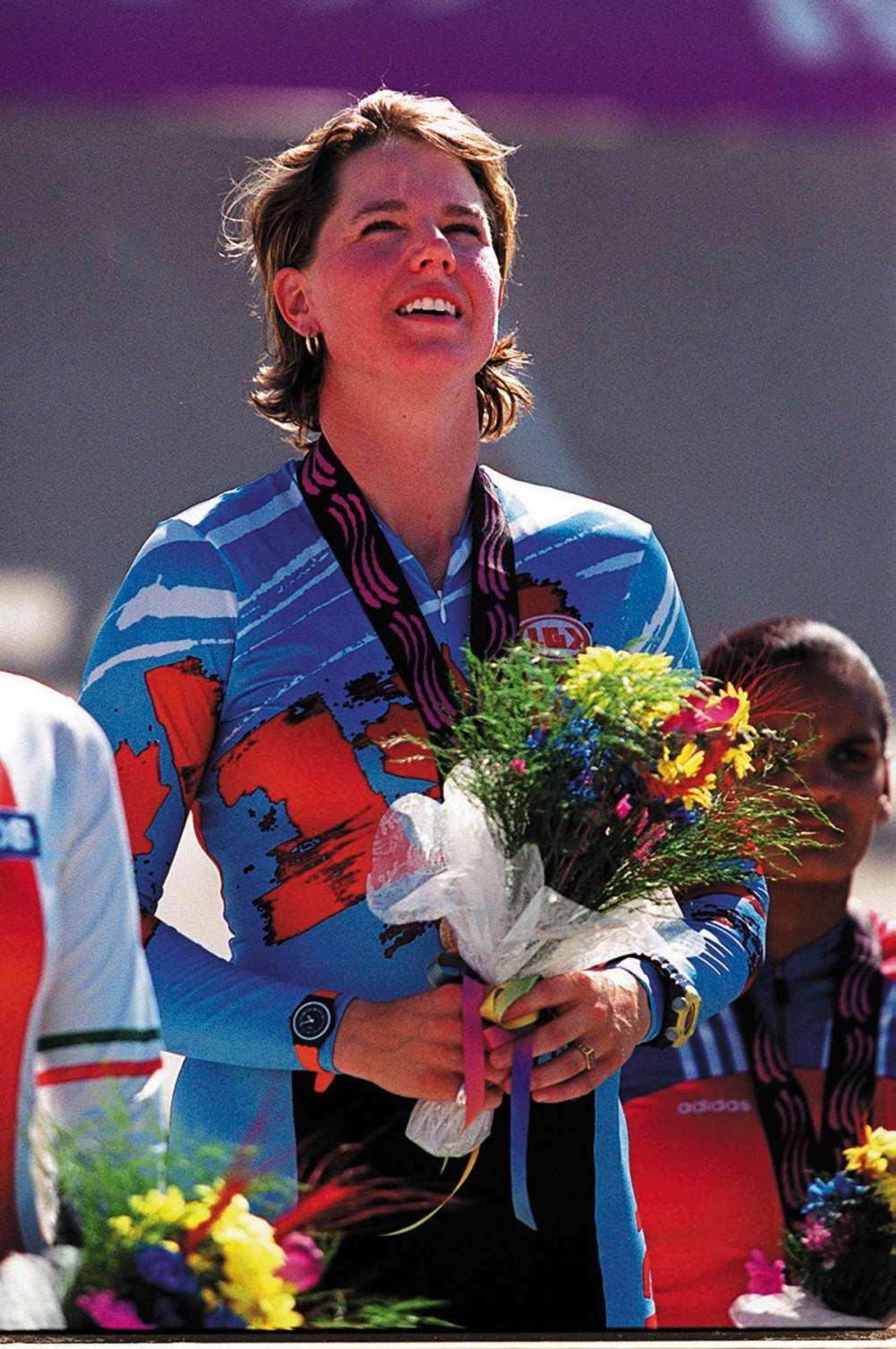 Photo by Ruth Bonneville / Winnipeg Free Press Photo Archives
Tanya Dubnicoff listens to the Canadian national anthem on the medal podium after winning gold in the cycling sprint event at the 1999 Pan American Games in Winnipeg.
