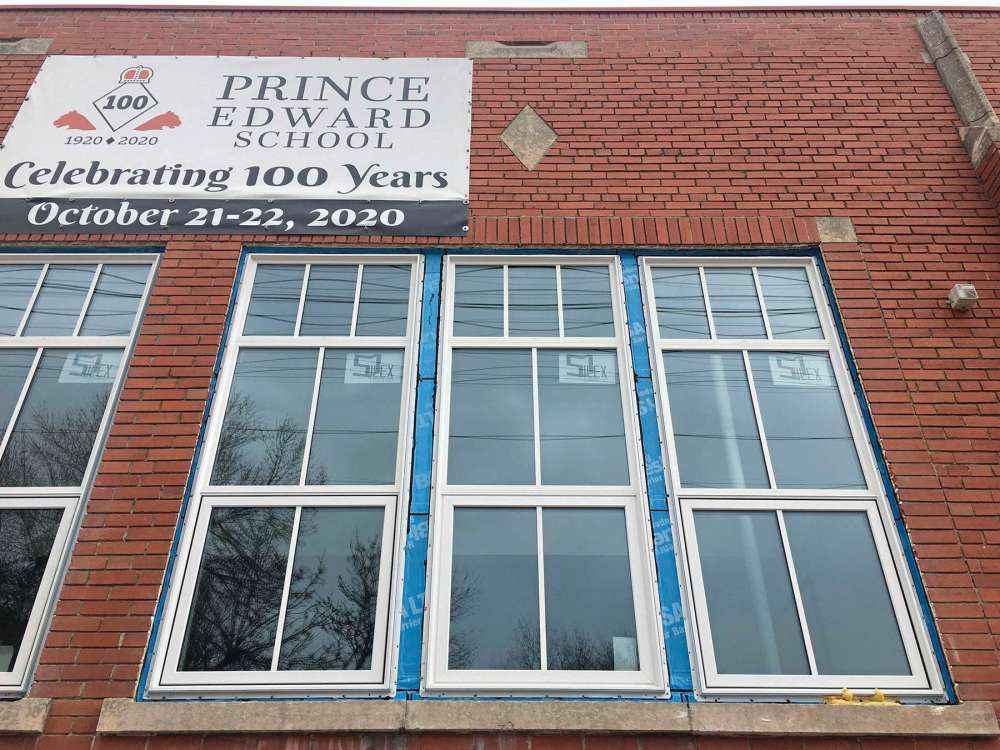 Photo by Shirley Kowalchuk 
Blue and spray foam insulation can be seen around Prince Edward School’s new energy-efficient, custom-made, historic looking window frames.