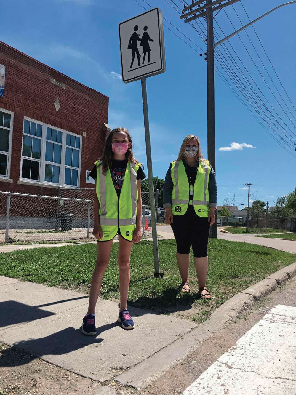 Shirley Kowalchuk
One of two student patrol team captains, Sloane Borodenko, stands with patrol co-ordinator and teacher Delila Heinrichs at one of three intersections patrolled by Prince Edward School students in the patrol safety program.