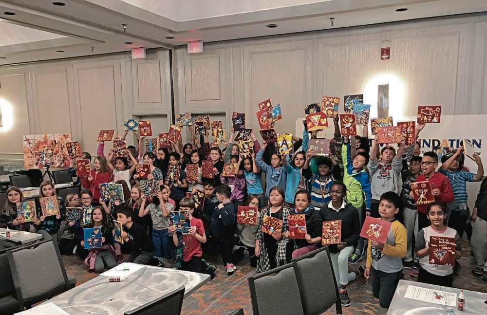 Sou'wester
Students show off their artwork at a creative workshop hosted by Yisa Akinbolaji and other artists at the Holiday Inn South.