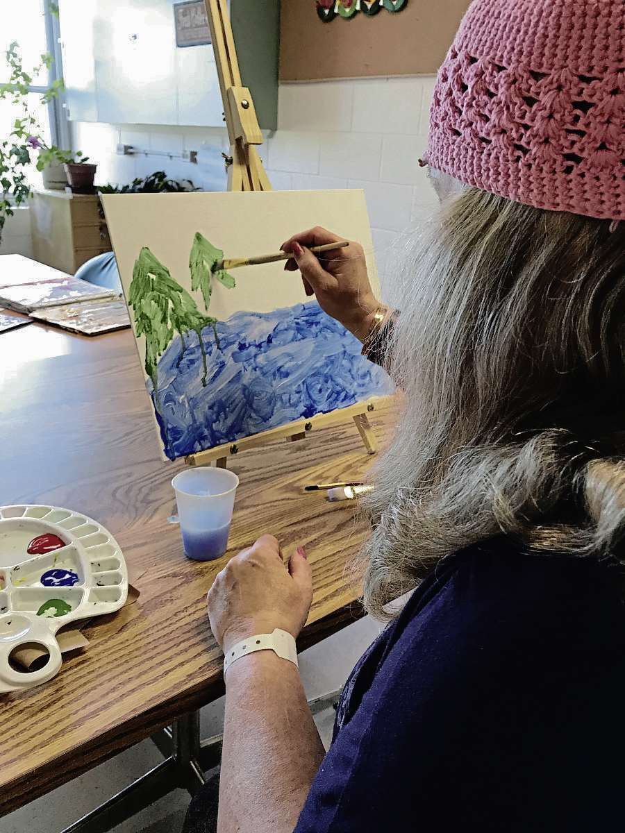 Supplied photo
A St. Boniface Hospital patient paints during a recreation therapy session.