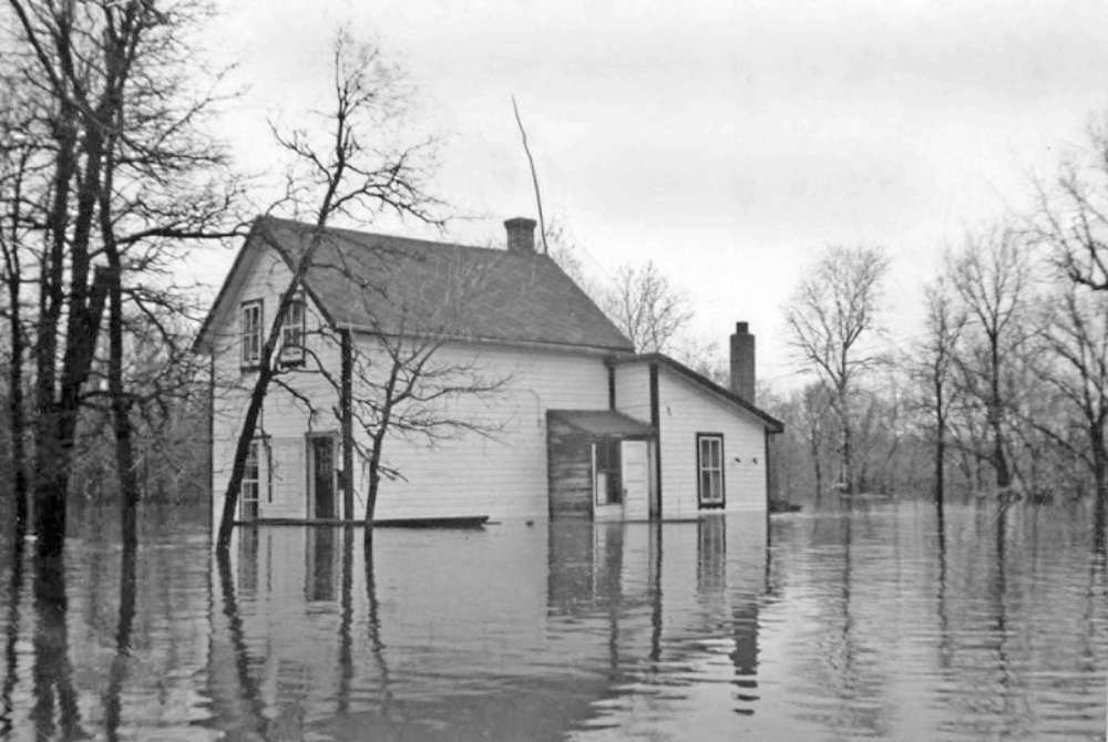 Supplied photo
The Holliday family home on Sadler Avenue is pictured during the 1950 flood.
