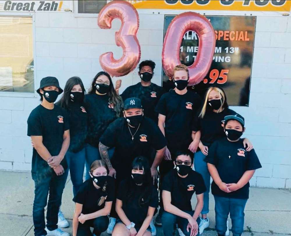Supplied photo
Chris Pagdato, centre, and the staff of the Pizzaland outlet at 2579 Portage Ave., celebrate the pizza restaurant’s 30th anniversary.