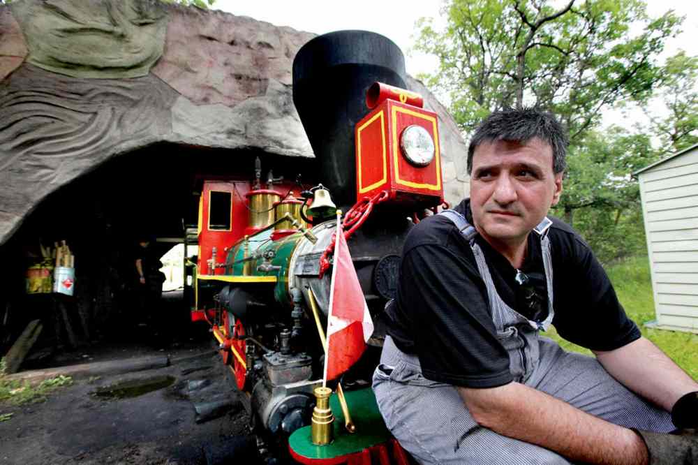 Ruth Bonneville/ Winnipeg Free Press archives
Timothy Buzunis, owner/operator of the miniature steam engine at Assiniboine Park, pictured in a file photo from 2012. The train is celebrating its 50th birthday on July 29. Buzunis is inviting the public to come out and celebrate.