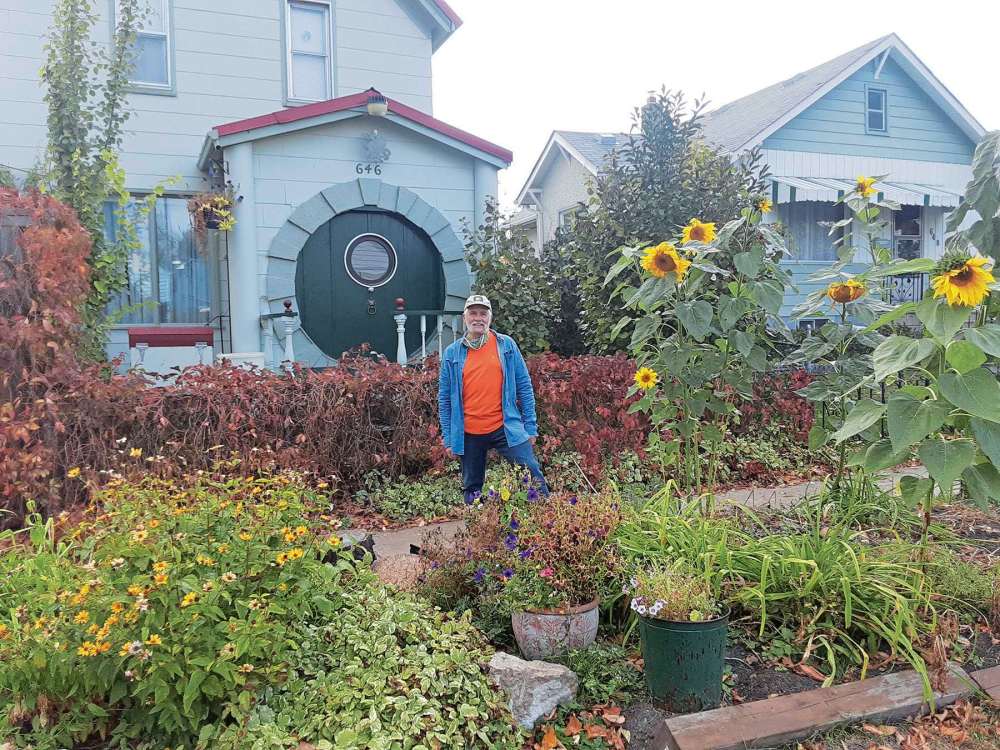 Photo by Tony Zerucha
Hardy Groening shows off the Hobbit Deck and Hobbit Door of his Victor Street residence. His decor and landscaping is inspired by J.R.R. Tolkien’s The Lord of the Rings.