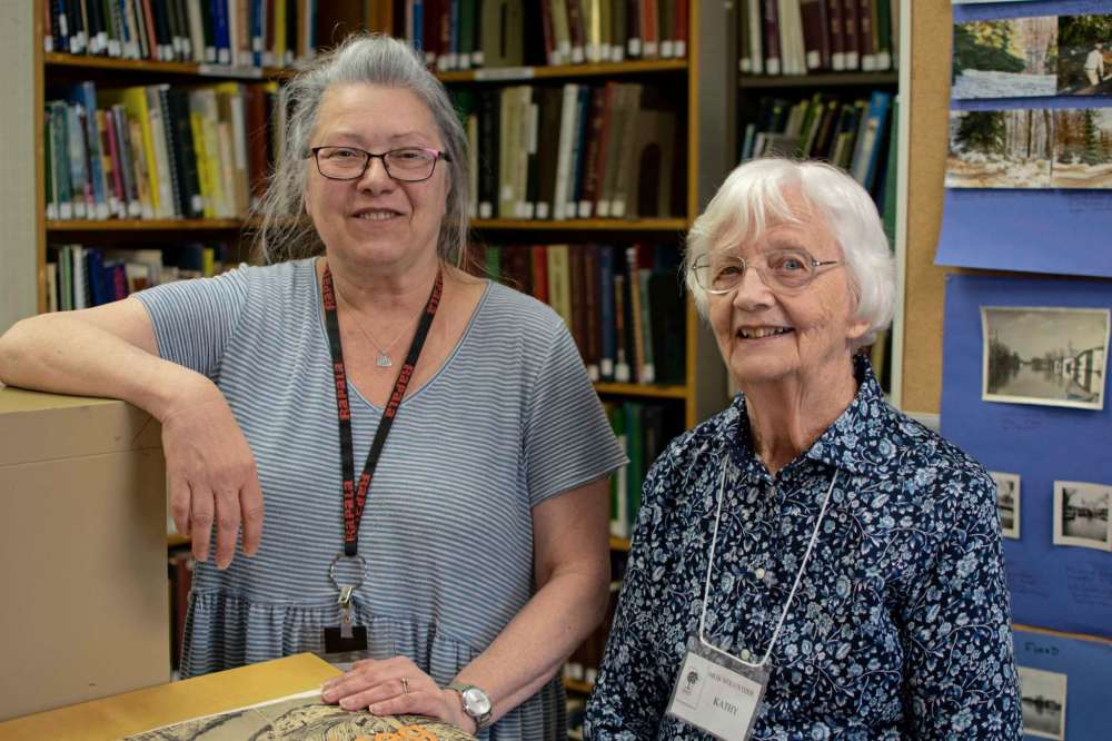 Photo by Eva Wasney
Longtime Manitoba Genealogical Society volunteers Mona Phillip and Kathy Stokes. The Society’s Winnipeg branch, located in the Polo Park area, is taking part in Doors Open Winnipeg for the first time this year.