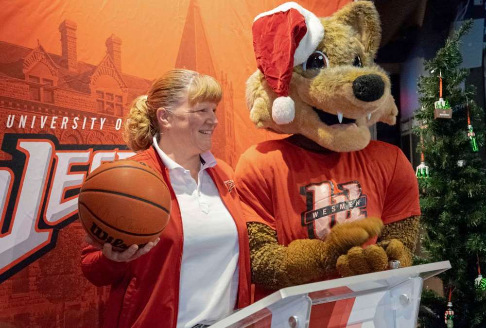 Photo by Eva Wasney
Wesmen womens’ basketball head coach Tanya McKay and mascot Wes Lee Coyote at the launch of the 2018 Wesmen Classic on Dec. 17.