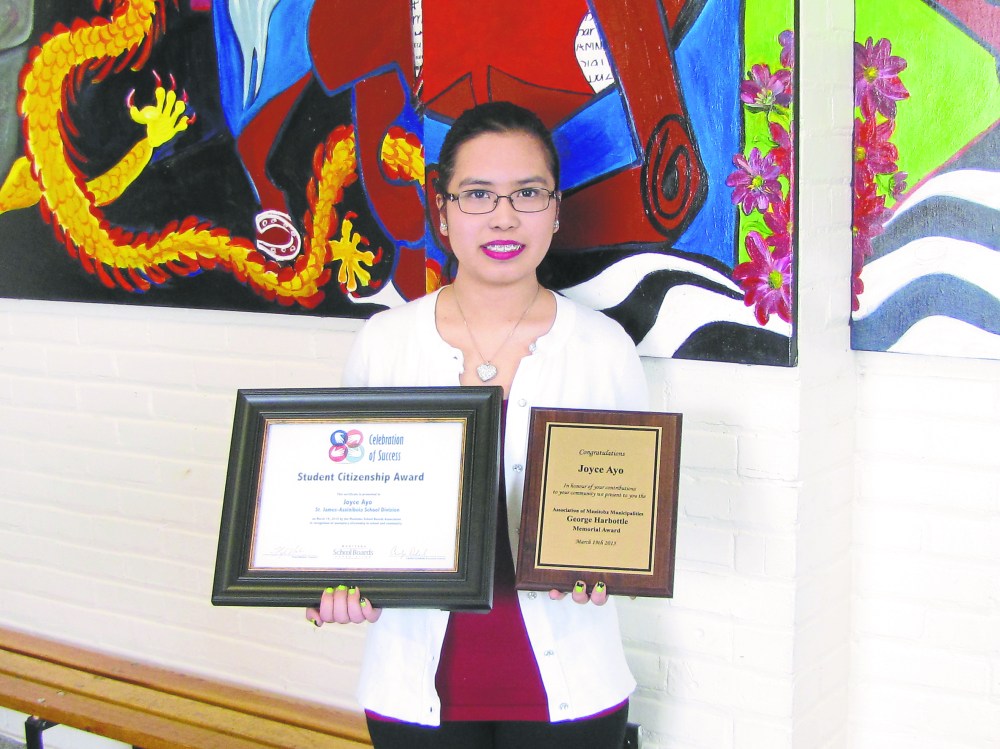 Photo by Jen Cameron
St. James Collegiate student Joyce Ayo with her community involvement awards.