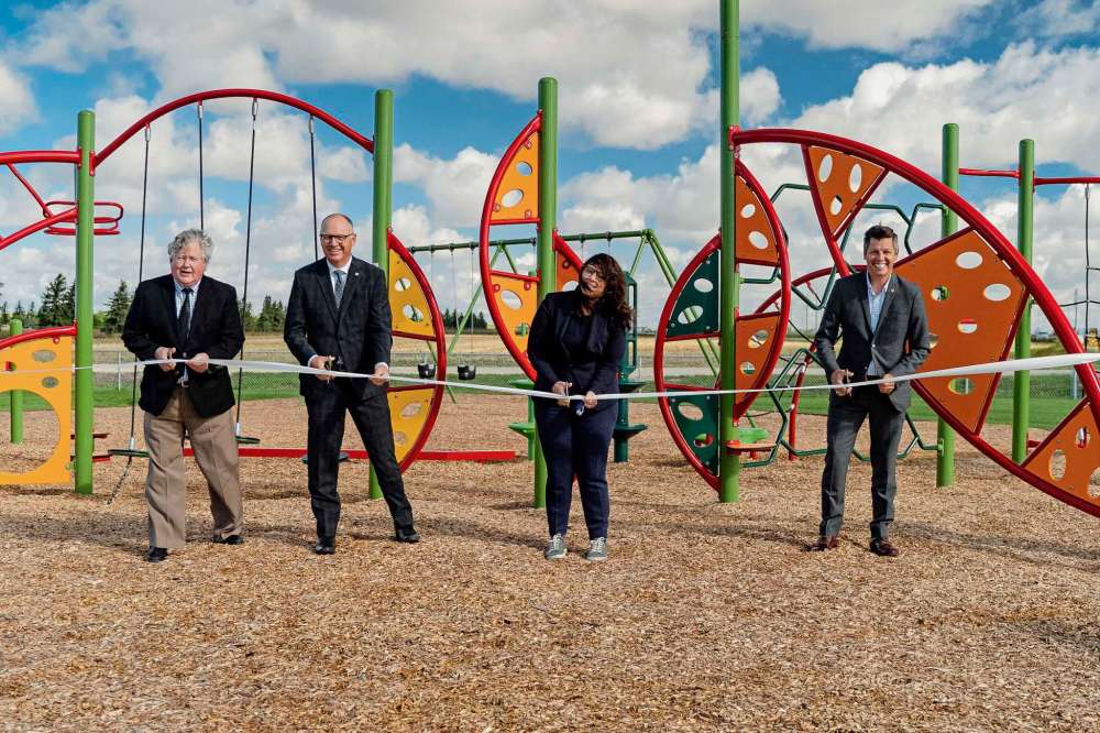 Supplied photo
Mayor Brian Bowman, Coun. Sherri Rollins (Fort Rouge-East Fort Garry) and Coun. Scott Gillingham (St. James) unveiled the expansion to Optimist Park. The expansion added a new play structure, a large soccer field and several other quality-of-life changes.