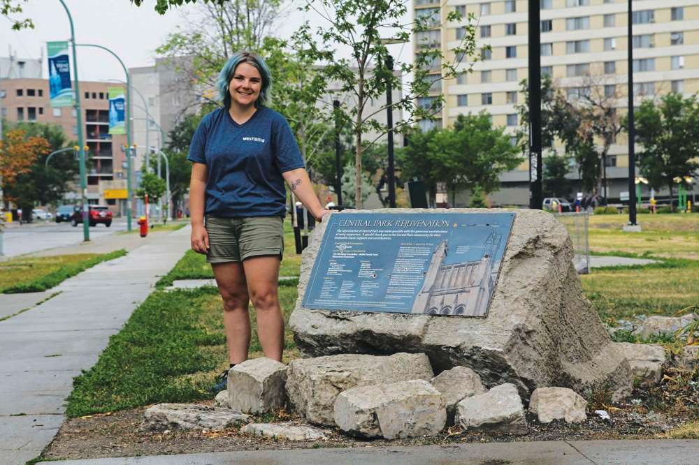 Photo by Katlyn Streilein
Iris Dyck, a tour guide with the West End BIZ, stands near a spire from the Knox United Church that fell off when lightning struck it in 2010.