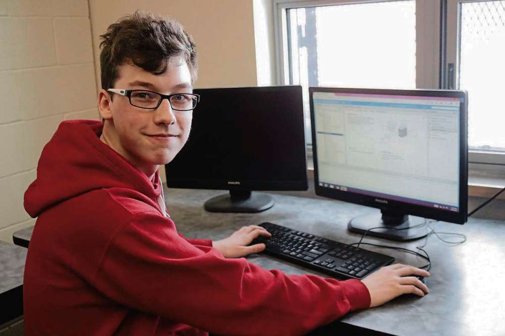 Photo by Ligia Braidotti
At Sisler High School, Dylan Bucci checks the computer and servers to make sure they are working and processing data for Krembil Research Institute.