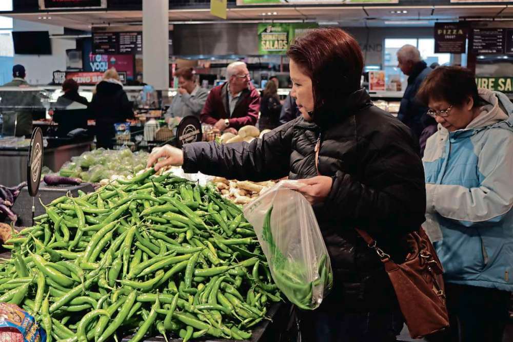 Ligia Braidotti
Maria Chingcuangco picks up some produce at Save-On-Foods International Northgate. She said she is excited to find more about the store’s selection.