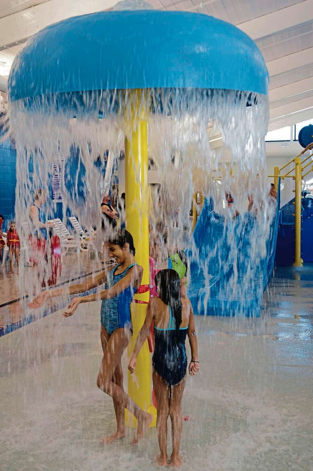 Supplied photo
Kids have fun at the new indoor splash pad at Seven Oaks Pool at the grand opening on March 28.