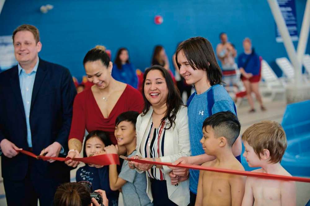 Supplied photo
Old Kildonan Coun. Devi Sharma (middle) cuts the ribbon at the Seven Oaks Pool grand opening on March 28, along with MLA Nic Curry (far left), Point Douglas Coun. Vivian Santos (second left) and local kids.