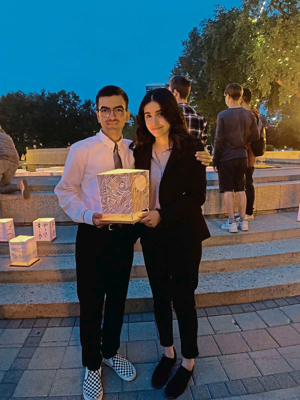 Supplied photo
River East Collegiate alumnus Avinash Singh (left) and Grade 12 student Rooj Ali, pictured here at a Lanterns of Peace event last summer, have been nominated for an international award for their advocacy for nuclear disarmament.
