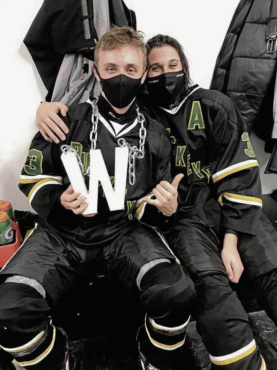 Supplied photo
(From left) Grade 12 defencemen Jayden Belza and Dylan Goldsworthy celebrate a recent win for the Miles Macdonell Buckeyes boys hockey team, who are competing this year in the Winnipeg High School Hockey League’s top Platinum Promotions Division.