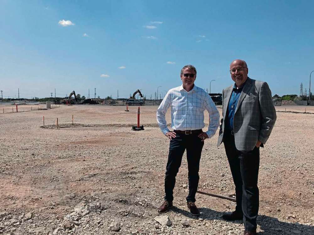 Sheldon Birnie
(From left) Keith Merkel, president of EdgeCorp Developments, and Coun. Russ Wyatt (Transcona) at the new Park City Commons development in West Transcona. When complete, the development will be home to 95,000 square feet of retail space and nearly 700 residential units. (SHELDON BIRNIE/CANSTAR/THE HERALD)