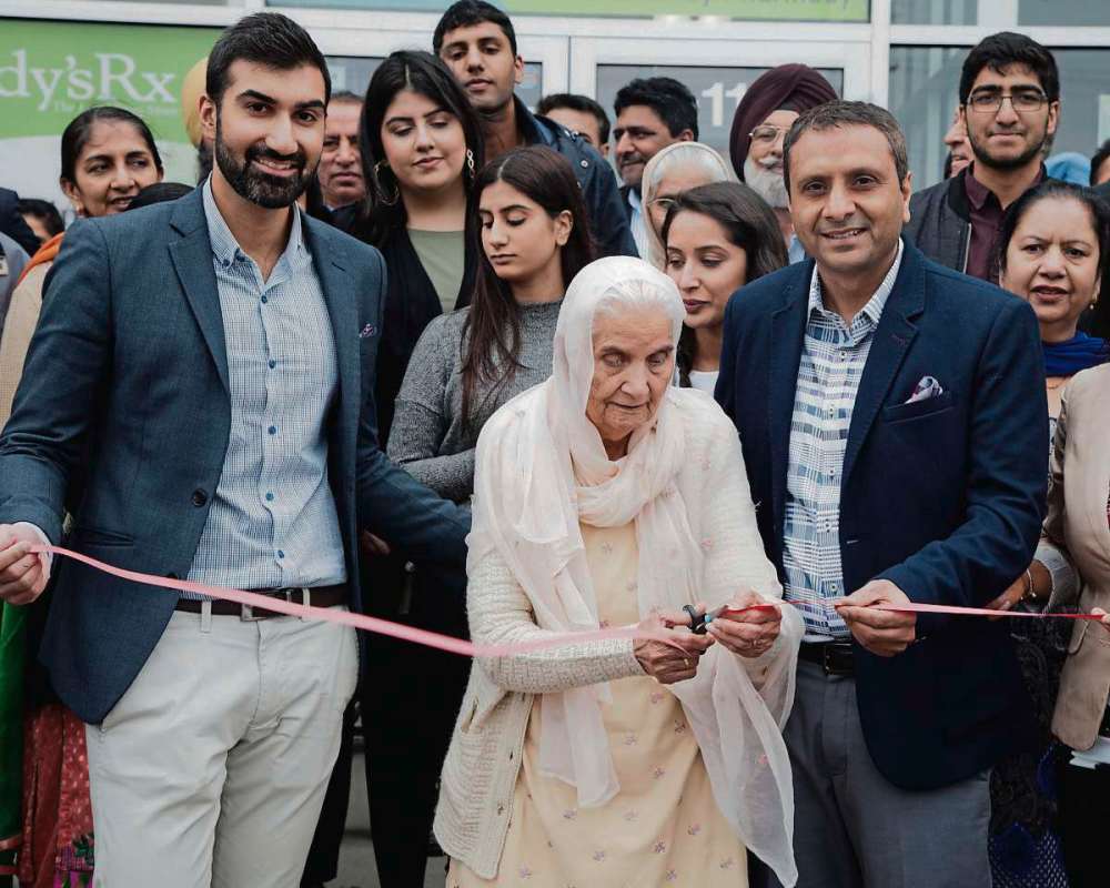 SUPPLIED PHOTO
Varinder Pandher (left) and Raj Gill with grandma Gurdev Kaur Pandher cutting the ribbon at Gateway Pharmacy and Medical Clinic’s grand opening on June 24.