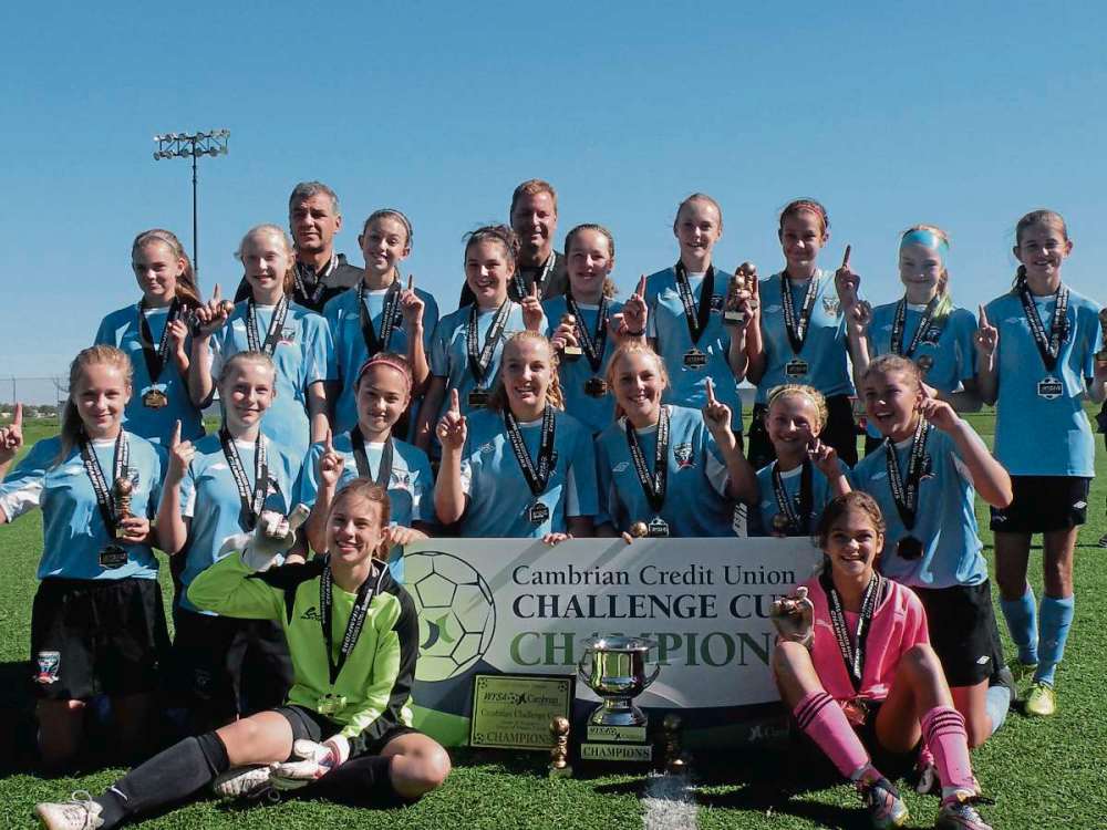 SUPPLIED PHOTO
Phoenix FC U13 Girls squad took home the Cambrian Challenge Cup, defeating rivals FC Northwest 2-1 at the Winnipeg Soccer Complex Sept. 20. Pictured above, left to right, back row: Holly Johnson, Tori Klus, assistant coach Gian Paolucci, Megan Hudohmet, Imogen Bigras, Head Coach - John Hudohmet, Neely Hammerbeg, Serena Algera, Camilla Paolucci, Reese Lange, Jenna Kunkel. Left to right front row: Rori Parkin, Michaela Bergen, Trinity Gowen, Callie Kjarsgaard, Amy Rheubottom, Mackenzie Sirdar, Sabrina Frick. Goalies : Brylin Shuttleworth (left) and Sydnee Korchak.