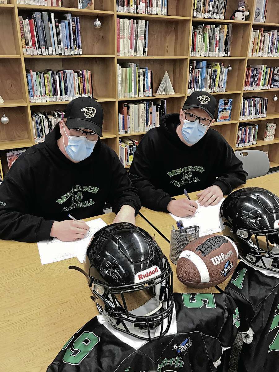 Sheldon Birnie
(From left) Drew and Jordin Boucher, Grade 12 students at Murdoch MacKay Collegiate, committed to play with the University of Manitoba Bisons on Dec. 15. (SHELDON BIRNIE/CANSTAR/THE HERALD)