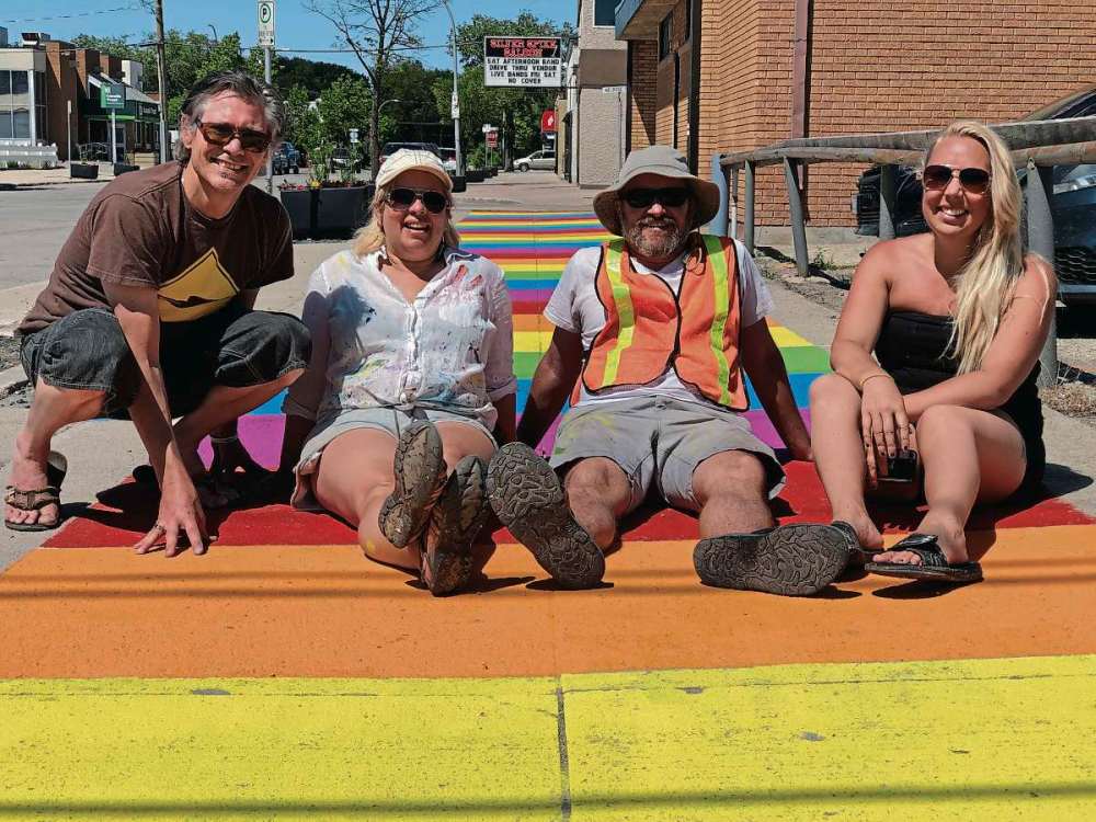 Supplied photo
(From left) Artists Darryl Neufeld, Glenna Evans, James Culleton, and Rachel Lancaster worked on the three Welcome Mats sidewalk murals that were painted along Bond Street on July 4 and 5. The murals are a BIZ initiative to get people visiting and talking about downtown Transcona.