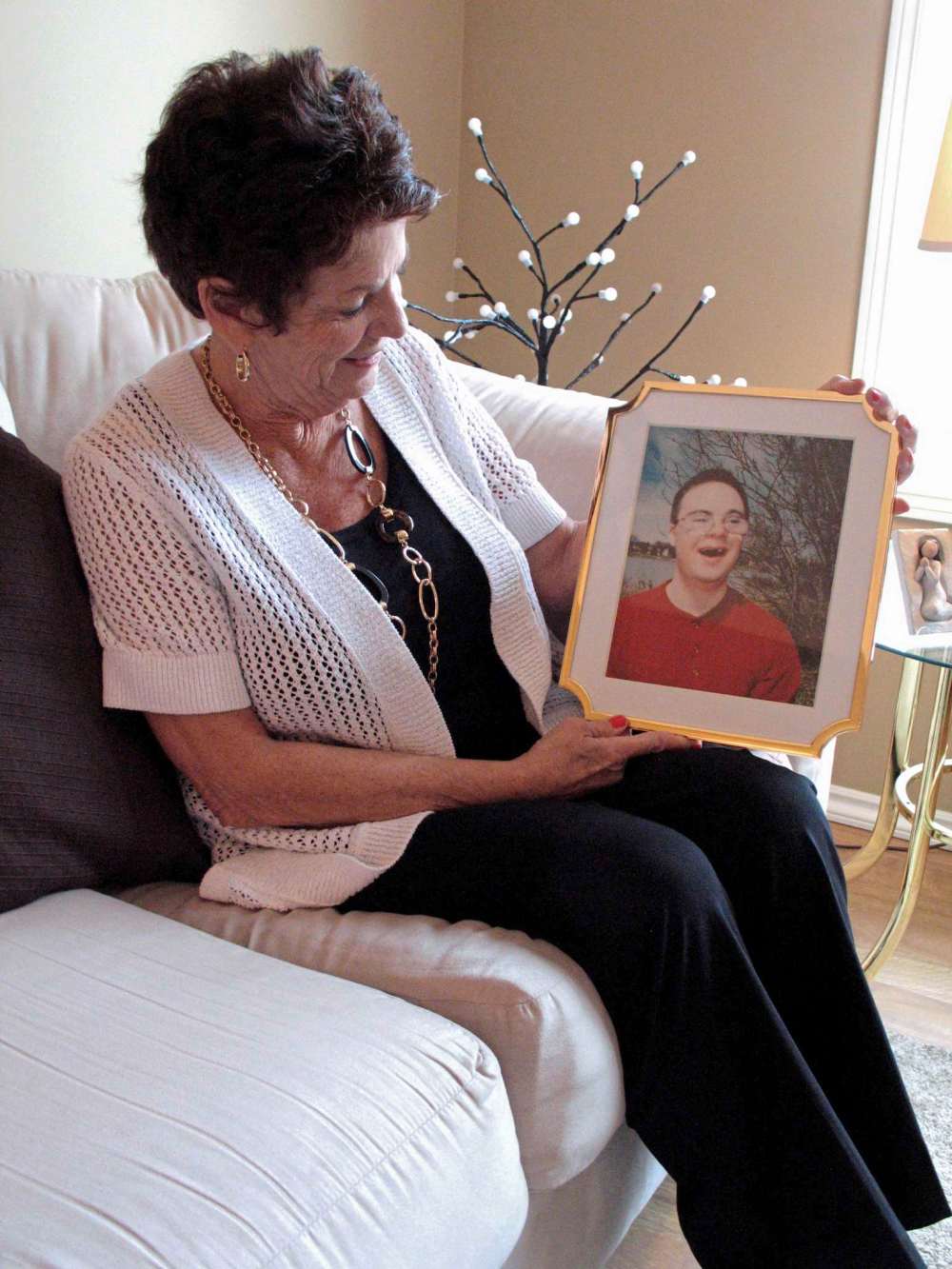 Simon Fuller
Tabs for Wheelchair founder Gwen Buccini holds a picture of her son, Anthony, who died last year. Buccini said Anthony was her