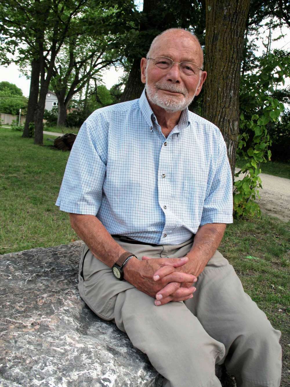 Simon Fuller
Jude Henteleff sits in front of tress planted by his forefathers.